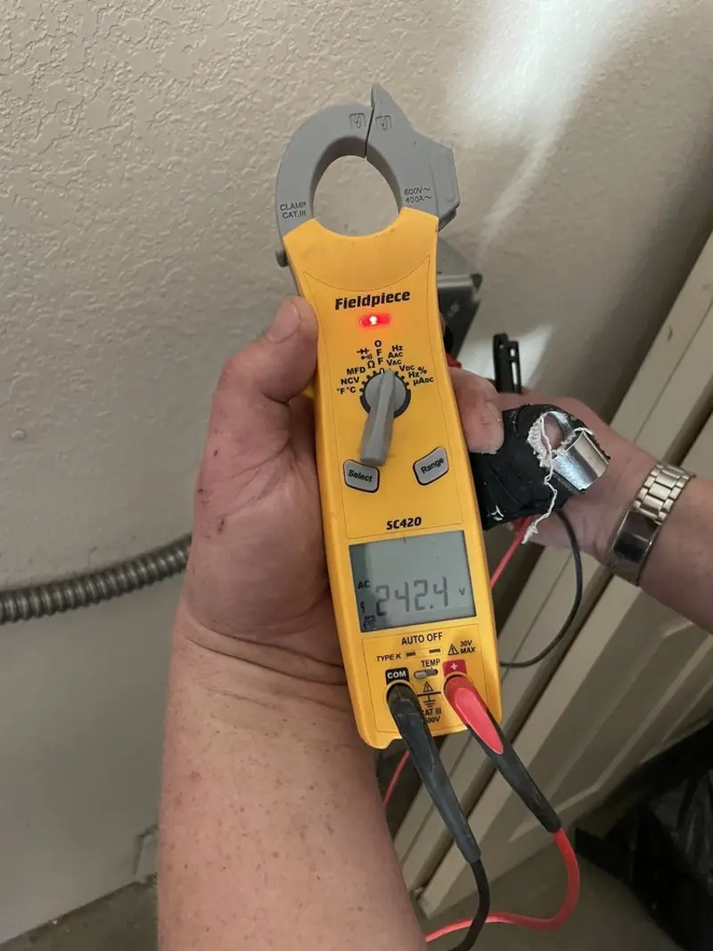 Voltage testing with clamp meter during Electrical Installation Services in Rainbow Lakes Estates